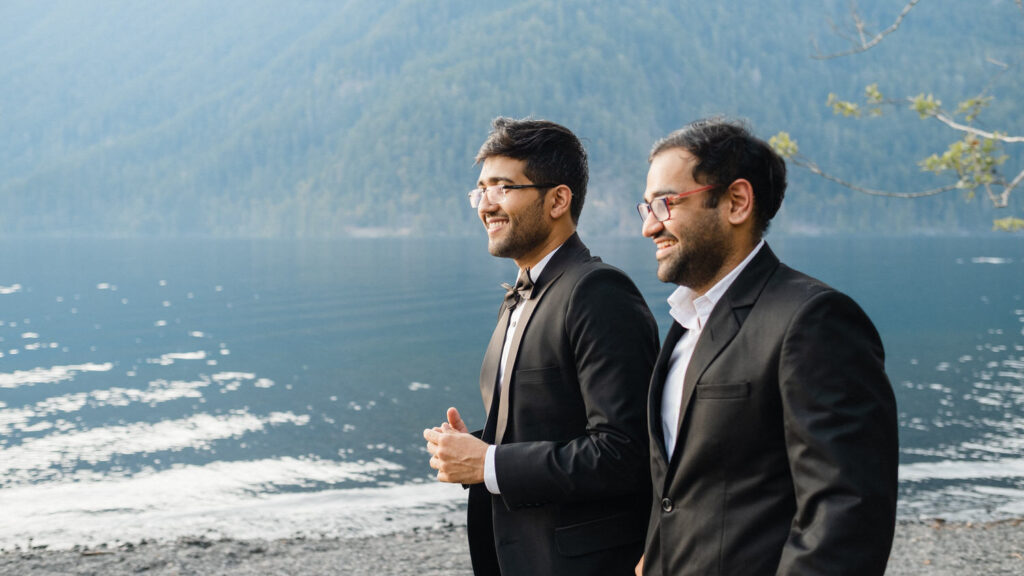 Groom walks up the aisle on the banks of Lake Crescent