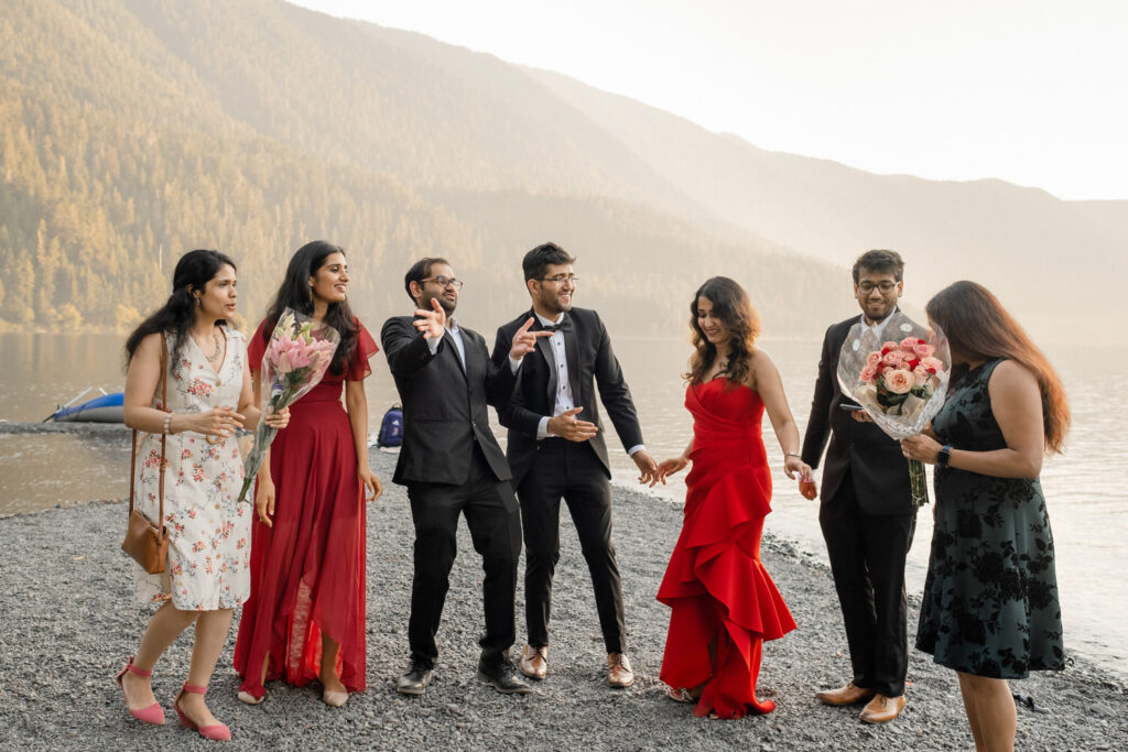 Bridal party dances on the shores of Lake Crescent
