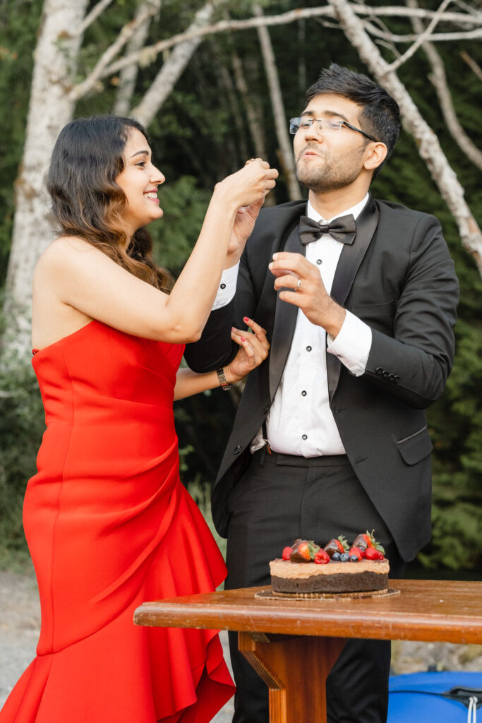 Bride feeds cake to the groom 