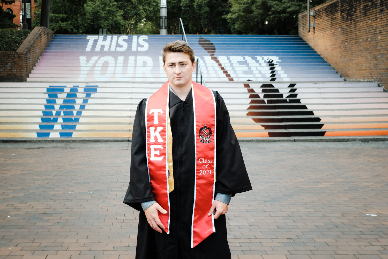 Portrait of UW graduate in front of steps