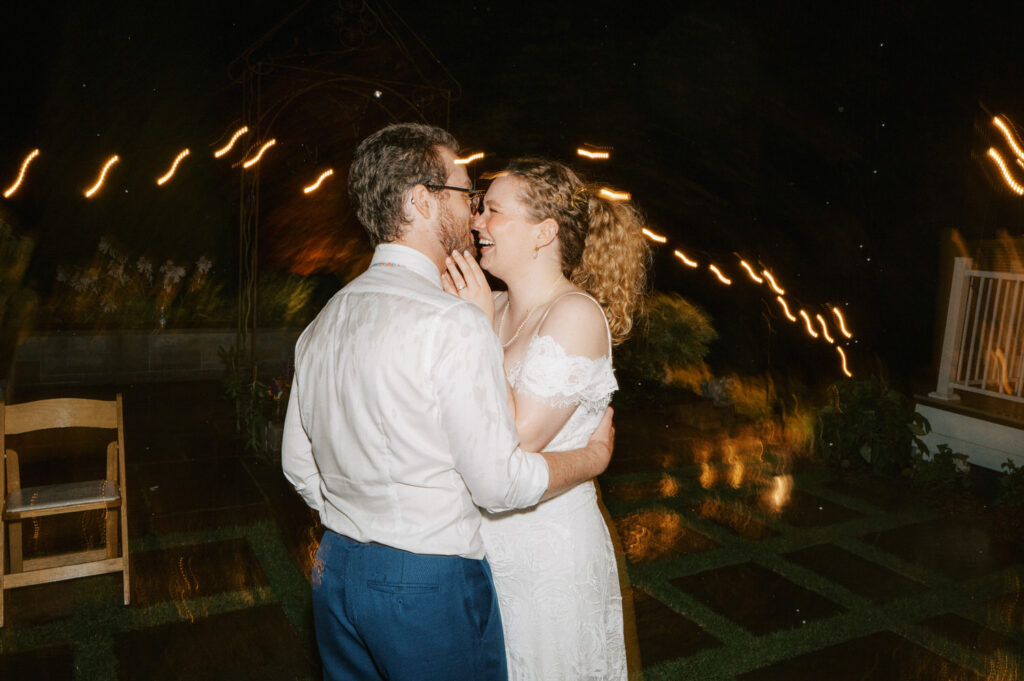 The bride and groom dance on as 
Seattle wedding photography continues during a record rainstorm.