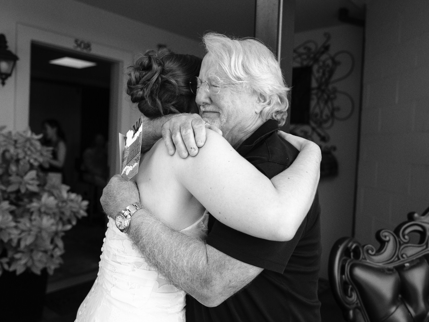 The Best Documentary Wedding Photography of 2025 19 A bride hugs her emotional father