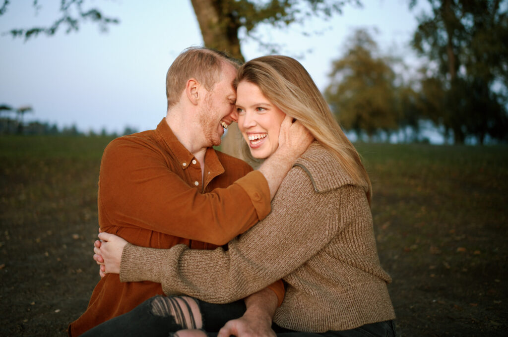 Couple smiling during their Seattle UW Arboretum engagement photoshoot.