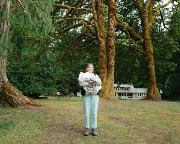 Olympic National Park Wedding | Sara and Robert's Summer Camp Wedding Weekend at NatureBridge 9 Guest portrait under large moss-covered trees at NatureBridge Olympic in Olympic National Park