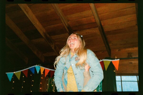 Olympic National Park Wedding | Sara and Robert's Summer Camp Wedding Weekend at NatureBridge 50 Guest dancing inside rustic lodge during wedding reception at summer camp venue