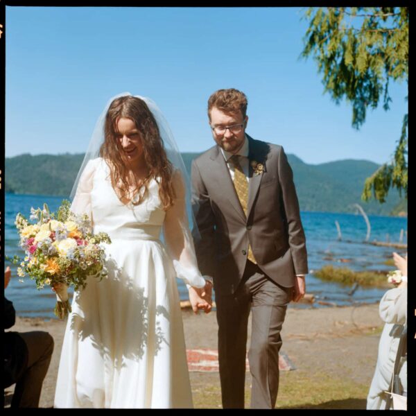Olympic National Park Wedding | Sara and Robert's Summer Camp Wedding Weekend at NatureBridge 27 Bride and groom walking back up the aisle after lakeside wedding ceremony