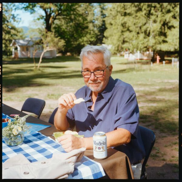 Olympic National Park Wedding | Sara and Robert's Summer Camp Wedding Weekend at NatureBridge 31 Wedding guest seated at outdoor reception table during summer camp wedding