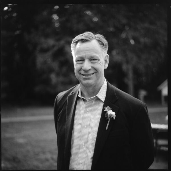 Olympic National Park Wedding | Sara and Robert's Summer Camp Wedding Weekend at NatureBridge 35 Black and white portrait of wedding guest wearing boutonniere before ceremony