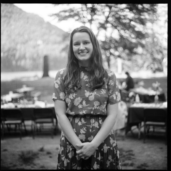 Olympic National Park Wedding | Sara and Robert's Summer Camp Wedding Weekend at NatureBridge 32 Black and white portrait of wedding guest outdoors during lakeside wedding reception