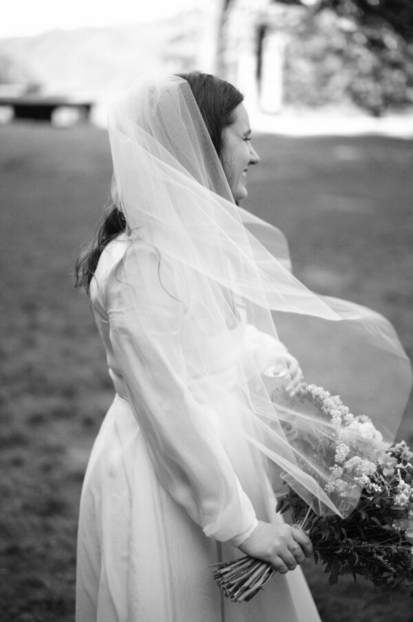 Olympic National Park Wedding | Sara and Robert's Summer Camp Wedding Weekend at NatureBridge 29 Black and white portrait of bride holding bouquet in veil before outdoor wedding ceremony