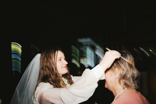 Olympic National Park Wedding | Sara and Robert's Summer Camp Wedding Weekend at NatureBridge 46 Bride dancing with family member during wedding reception celebration