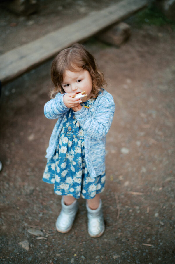 Olympic National Park Wedding | Sara and Robert's Summer Camp Wedding Weekend at NatureBridge 53 Child eating dessert during family-friendly summer camp wedding reception