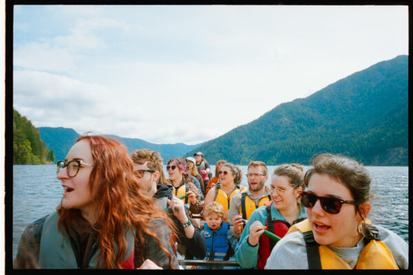Olympic National Park Wedding | Sara and Robert's Summer Camp Wedding Weekend at NatureBridge 63 Wedding guests paddling across Lake Crescent during post-wedding canoe adventure