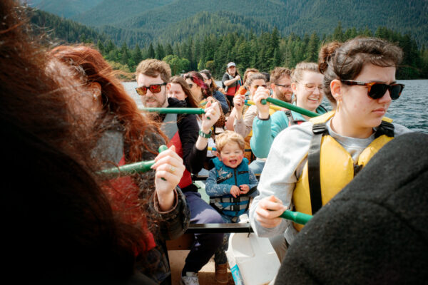 Olympic National Park Wedding | Sara and Robert's Summer Camp Wedding Weekend at NatureBridge 58 Wedding guests paddling canoe