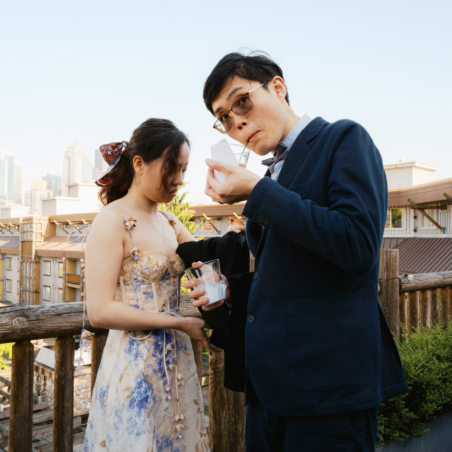 The Edgewater Hotel Wedding | Candid Seattle Wedding Photography for Amy & Mike 19 Couple sharing a candid moment with drinks during Amy and Mike’s Edgewater Hotel rooftop cocktail hour