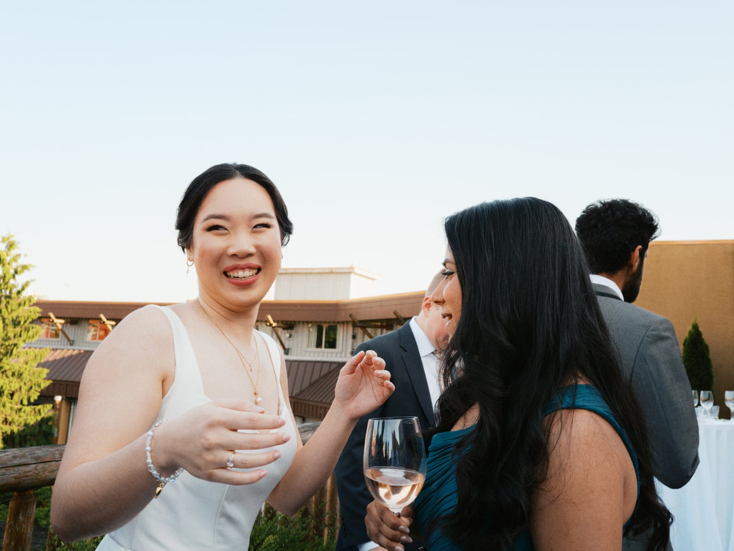 The Edgewater Hotel Wedding | Candid Seattle Wedding Photography for Amy & Mike 18 The bride smiling with a friend at the Edgewater Hotel wedding reception in Seattle, WA