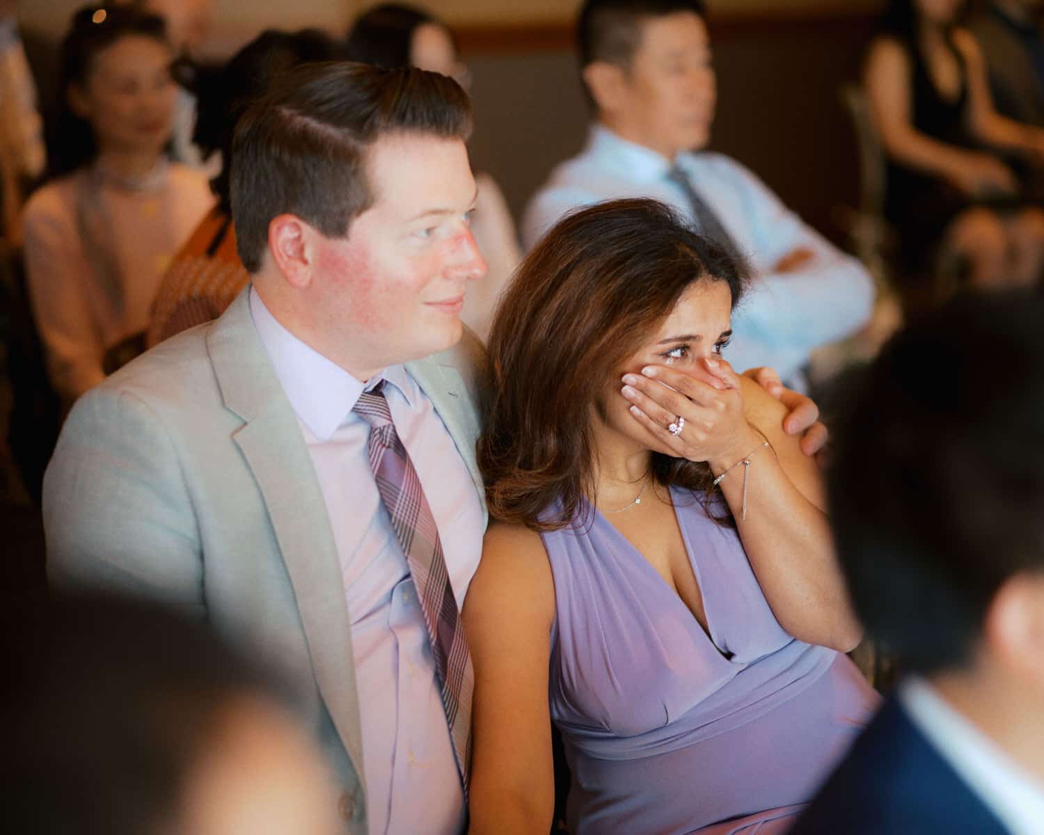 The Edgewater Hotel Wedding | Candid Seattle Wedding Photography for Amy & Mike 16 Wedding guest wiping away tears during Amy and Mike’s ceremony at the Edgewater Hotel in Seattle
