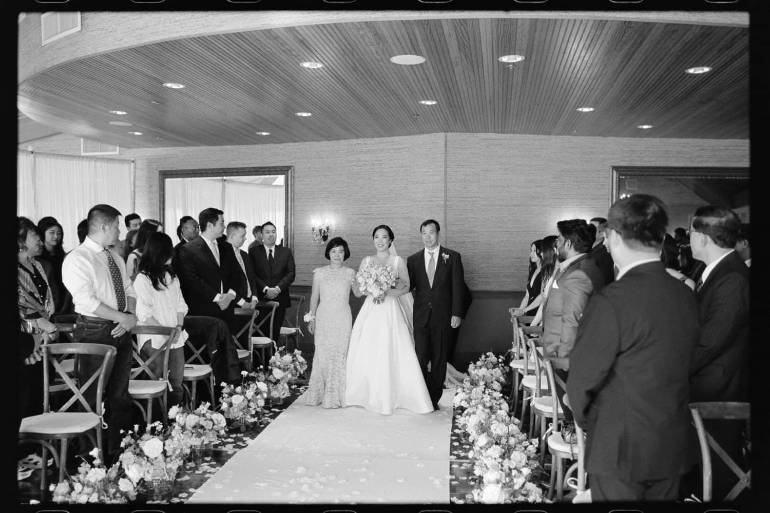 The Edgewater Hotel Wedding | Candid Seattle Wedding Photography for Amy & Mike 13 Amy walking down the aisle with her parents at the Edgewater Hotel wedding ceremony in Seattle
