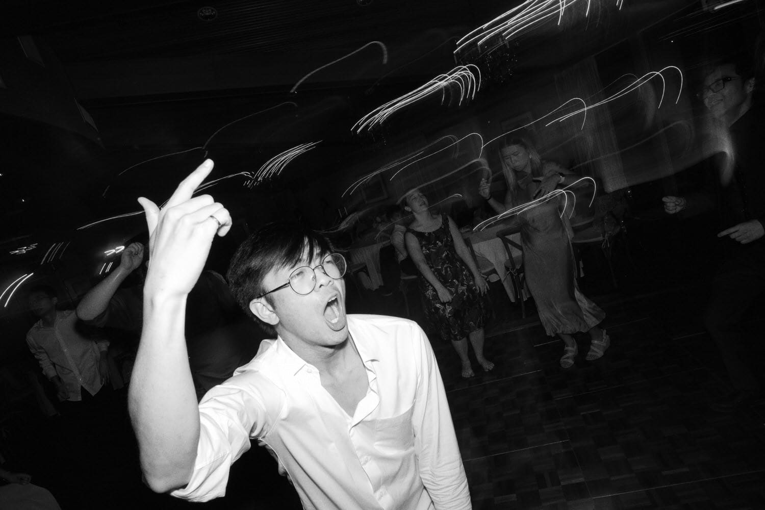The Edgewater Hotel Wedding | Candid Seattle Wedding Photography for Amy & Mike 31 Guest dancing energetically on the floor during Amy and Mike’s Edgewater Hotel wedding reception