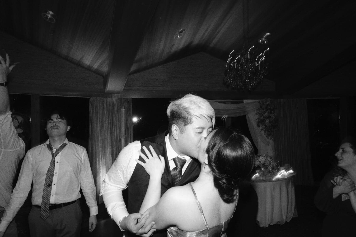 The Edgewater Hotel Wedding | Candid Seattle Wedding Photography for Amy & Mike 34 Amy and Mike sharing a kiss on the dance floor at their Edgewater Hotel wedding in Seattle
