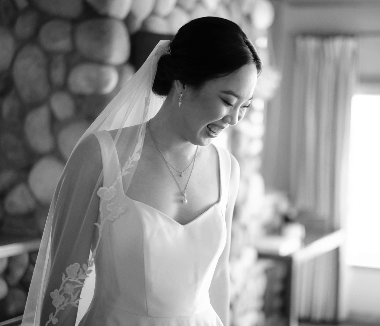 The Edgewater Hotel Wedding | Candid Seattle Wedding Photography for Amy & Mike 6 Amy smiling in her wedding dress and veil while getting ready at the Edgewater Hotel in Seattle, WA