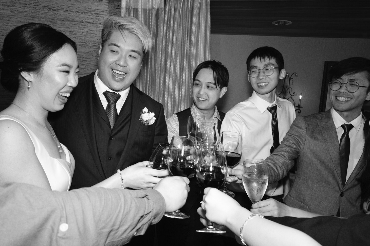 The Edgewater Hotel Wedding | Candid Seattle Wedding Photography for Amy & Mike 22 Amy and Mike toasting with friends during their Edgewater Hotel wedding reception in Seattle, WA