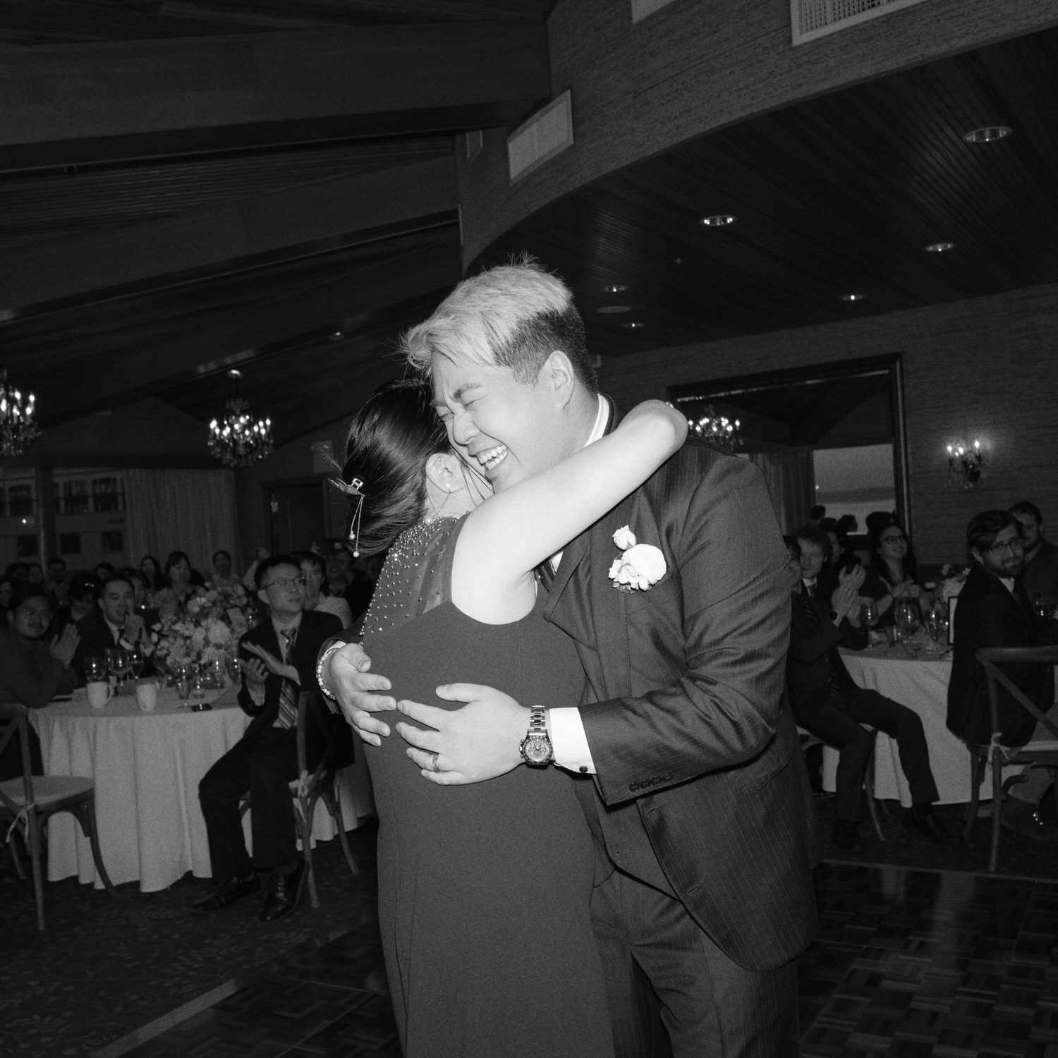 The Edgewater Hotel Wedding | Candid Seattle Wedding Photography for Amy & Mike 28 Groom hugging his mom during the Edgewater Hotel wedding reception in Seattle, WA