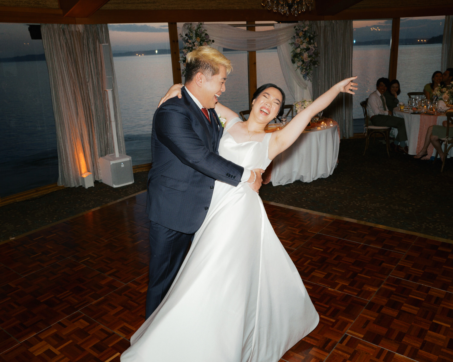The Edgewater Hotel Wedding | Candid Seattle Wedding Photography for Amy & Mike 27 The groom dips the bride during their first dance at the Edgewater Hotel